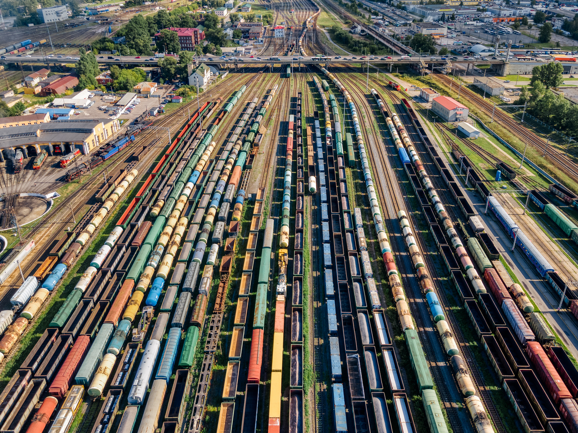 Rail: Aerial Photo Of Lots Of Various Wagons: Tanks, Platforms, Dump Trucks, Dumpcars Stay On Railways At Terminal.