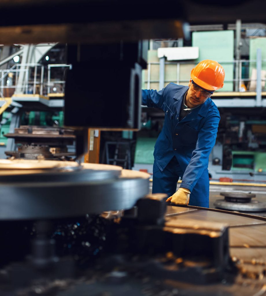 Turner Stanging At The Automated Lathe, Factory